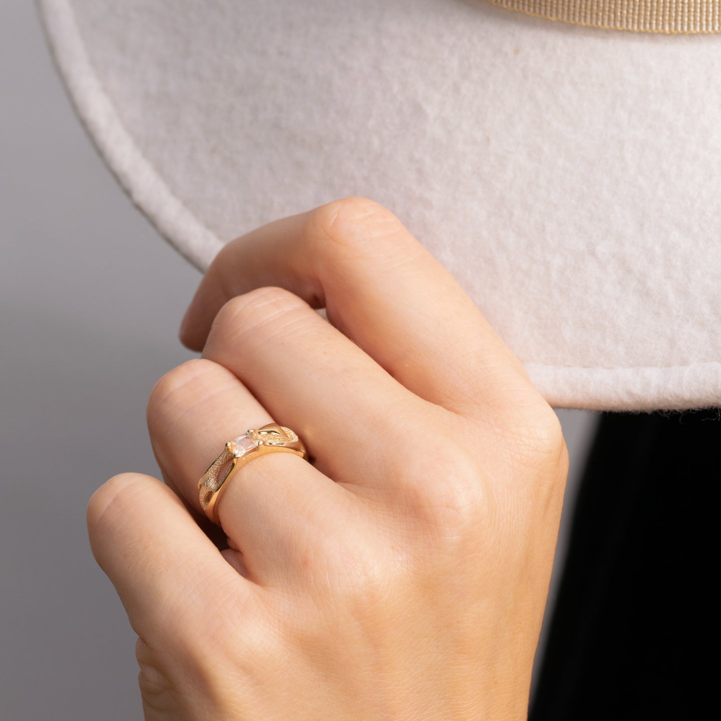 Orme-Brown Contemporary Fine Jewellery ethical engagement ring in sustainable recycled 9ct yellow gold with claw set baguette rectangular white orange sapphire
