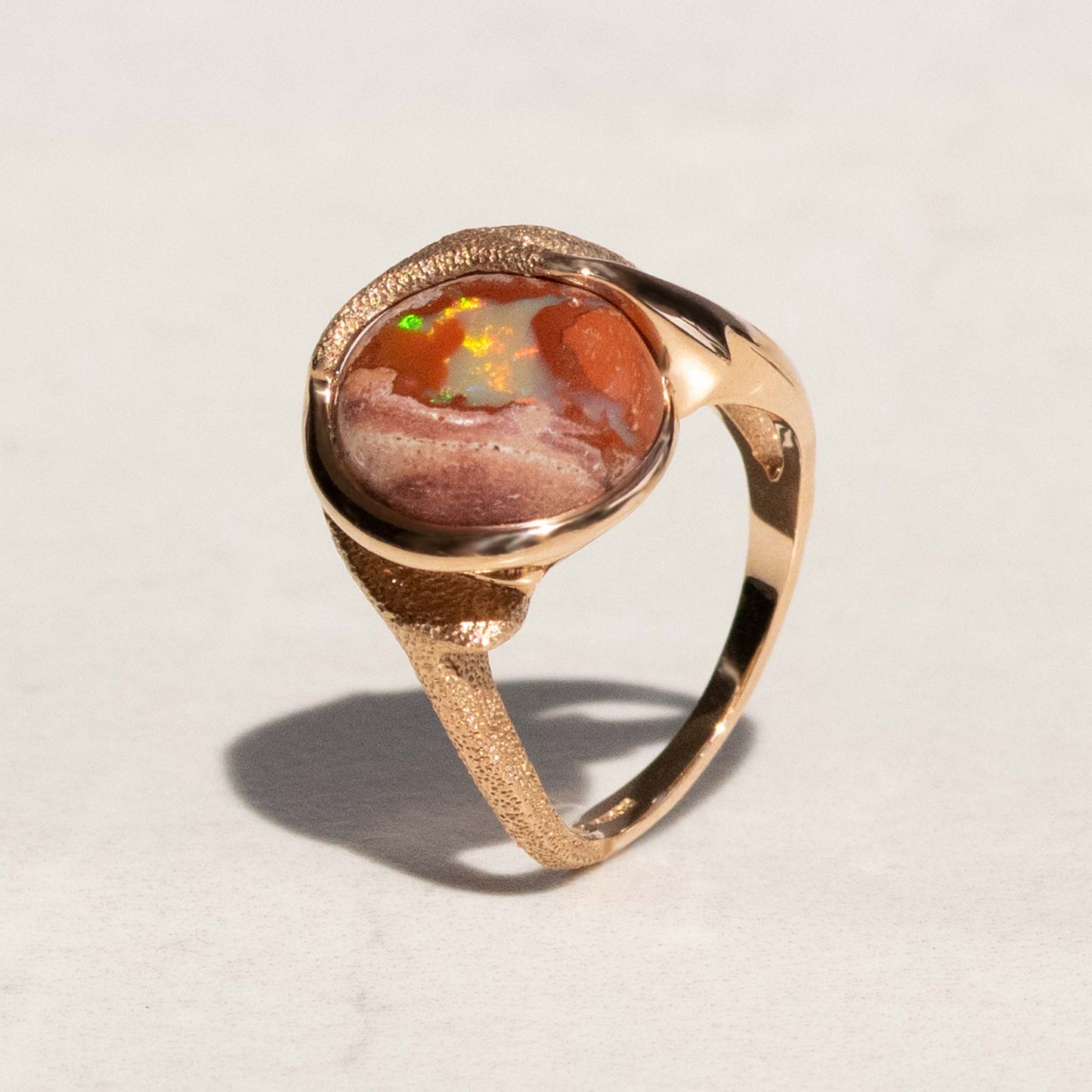 Orme-Brown Contemporary Fine Jewellery Ethical Arrow Statement Ring in sustainable recycled 18ct rose gold and a round Mexican fire opal (TipToe)
